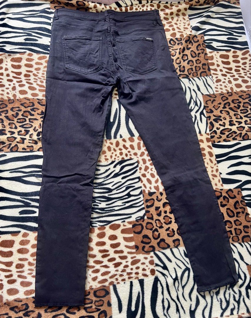 Mango Black Skinny Ripped Jeans (Category: Jeans) located in Quezon City. Submitted by marys_collection (Listing ID 1459998620, Image 3). Description: - Brand: Mango - Style: Black skinny jeans - Features: Rips on the front, small metal detail on back pockets - Occasion: Great for casual wear.