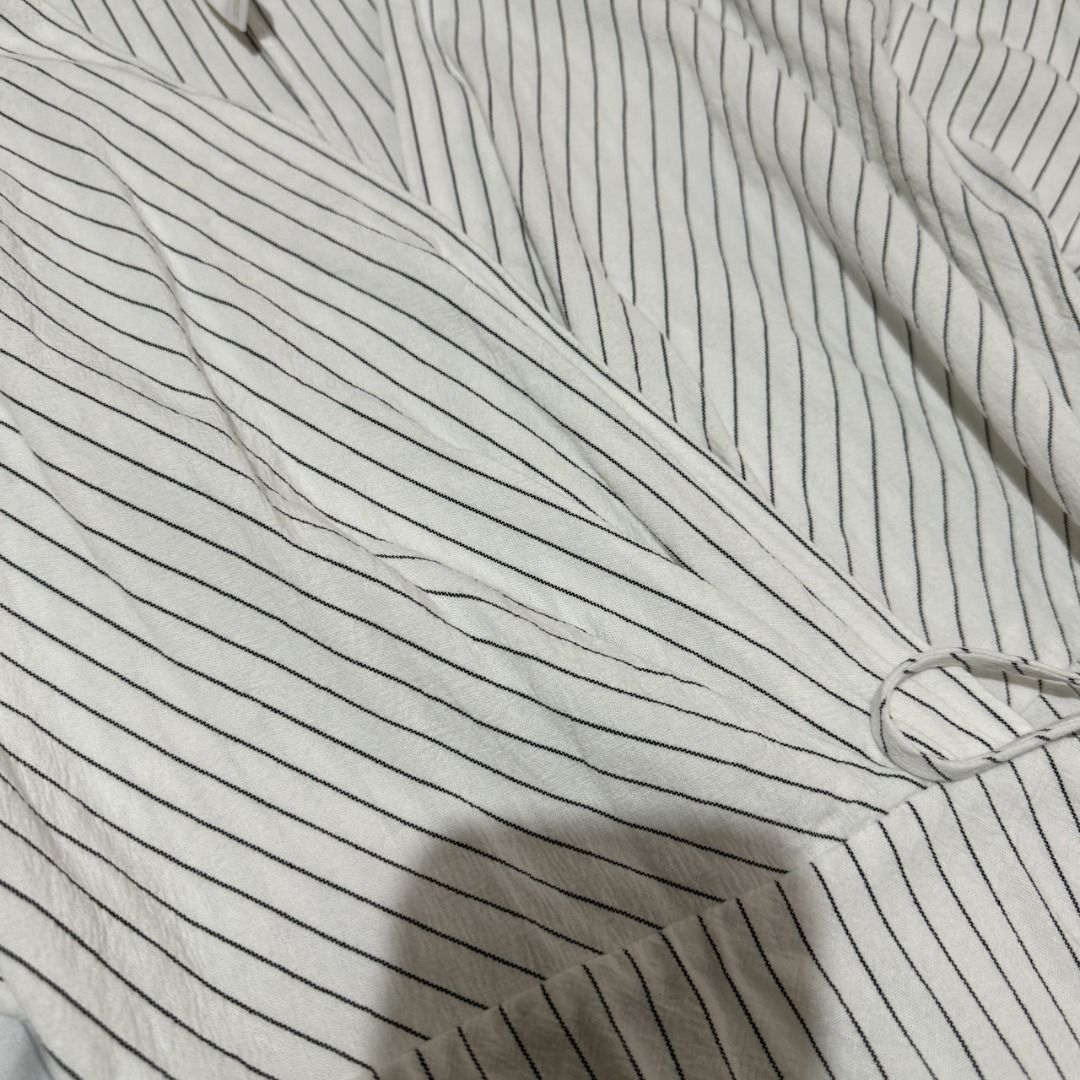 Mango Striped Wrap Maxi Dress (Category: Dresses) located in Dasmarinas. Submitted by kiyanah (Listing ID 1460001597, Image 3). Description: - white and black striped wrap maxi dress - sizing runs a bit large - worn 2 times only RFS: not my style anymore; decluttering Measurement: Length - 50.5 inches Waist - adjustable; measurement may vary.