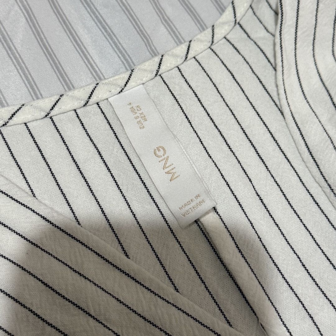 Mango Striped Wrap Maxi Dress (Category: Dresses) located in Dasmarinas. Submitted by kiyanah (Listing ID 1460001597, Image 2). Description: - white and black striped wrap maxi dress - sizing runs a bit large - worn 2 times only RFS: not my style anymore; decluttering Measurement: Length - 50.5 inches Waist - adjustable; measurement may vary.