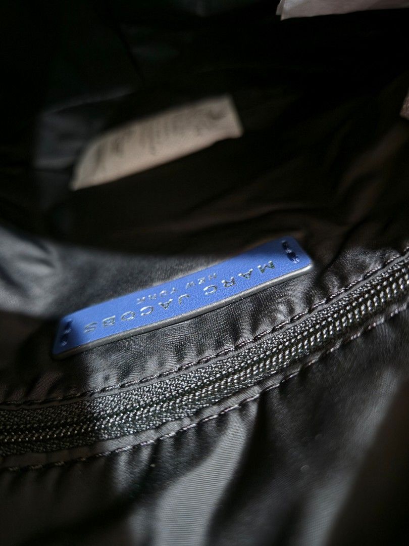 Marc Jacobs Navy Nylon Crossbody Bag (Category: Luxury Bags & Wallets) located in Taytay. Submitted by passiveincome89 (Listing ID 1460003939, Image 3). Description: - Navy blue Marc Jacobs crossbody bag - Made from durable nylon - Secure zip closure - Convenient front pocket - Adjustable strap for comfortable wear - Brand new with original tags - Ideal for everyday essentials.