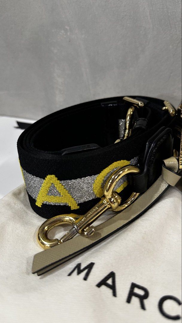 Marc Jacobs Snapshot Camera Bag with Strap (Category: Luxury Bags & Wallets) located in Rizal. Submitted by dumbchowdy (Listing ID 1460037394, Image 3). Description: - Authentic Marc Jacobs Camera Bag - Color: Neutral Beige - Iconic Gold Double J Logo on Front - Comes with Black and Yellow Striped Strap - Includes Original Dust Bag - Ideal for Everyday Use.