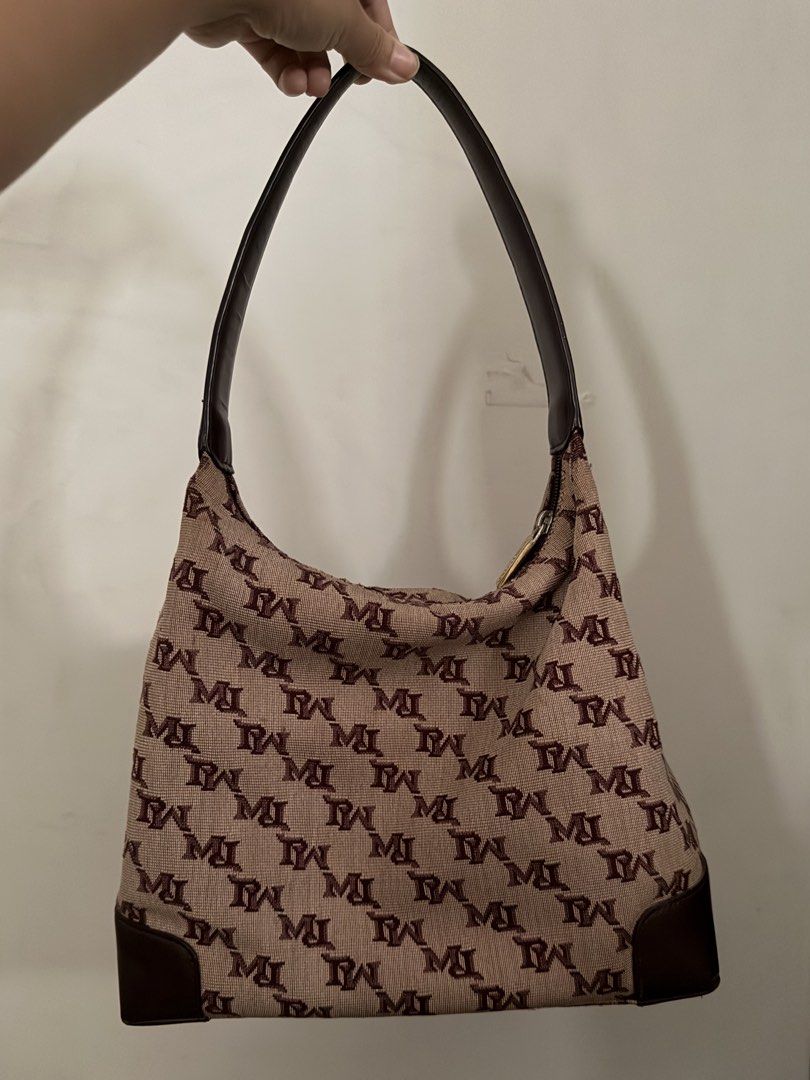 MARCO POLO Monogram Hobo Shoulder Bag (Category: Luxury Bags & Wallets) located in Cebu City. Submitted by fourfivedeclutter (Listing ID 1460102727, Image 1). Description: - MARCO POLO monogram shoulder bag - Secure zipper closure with branded pull tab - Durable leather trim on bottom and strap - Fits a lot (foldable umbrella, wallet, phone, etc).