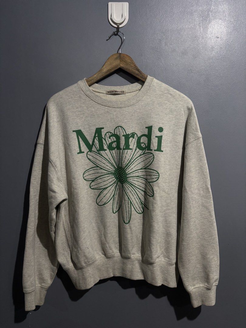 Mardi Mercredi Grey Daisy Sweatshirt (Category: Coats, Jackets and Outerwear) located in Manila. Submitted by happywind_ba7b96 (Listing ID 1460044210, Image 1). Description: - Mardi Mercredi grey sweatshirt - Features a green daisy graphic on the front - Classic crewneck style with long sleeves - Made from 100% soft cotton - Ideal for everyday casual wear - Easily pairs with jeans, shorts, or skirts.