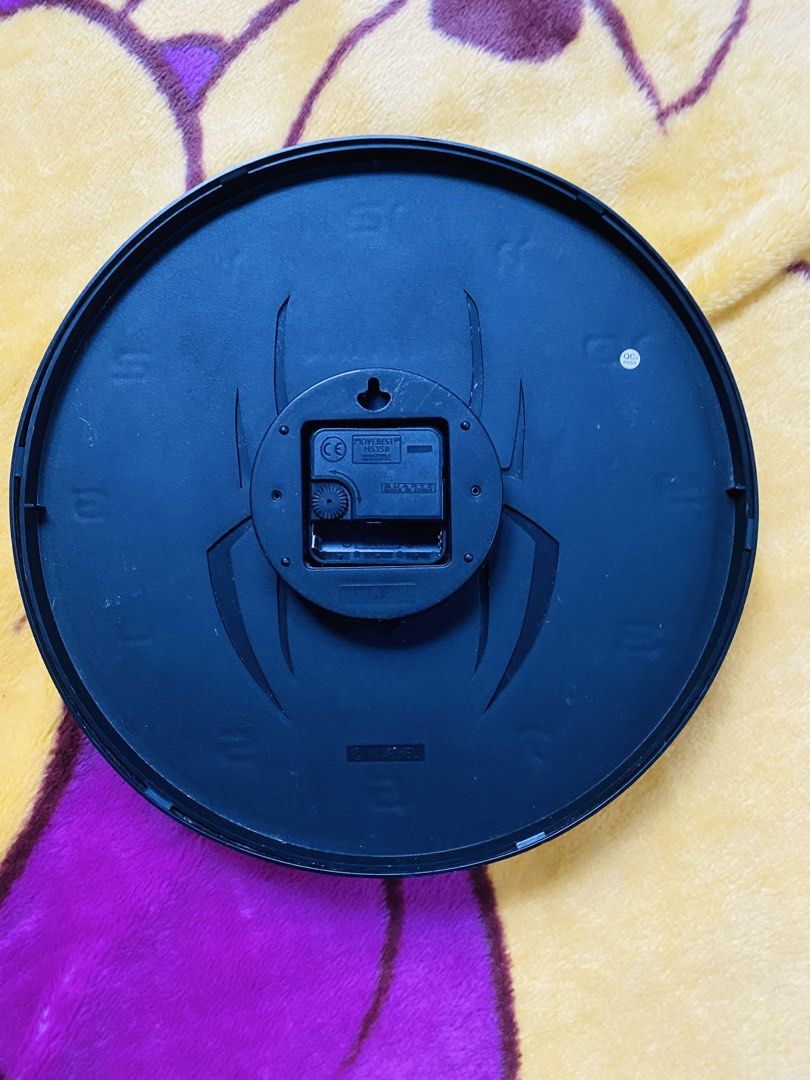Marvel Spider-Man Wall Clock (Category: Clocks) located in San Jose del Monte. Submitted by cityhanter007 (Listing ID 1460007347, Image 2). Description: - Cool Spider-Man wall clock - Black face with metallic spider logo - Easy-to-read numbers - Perfect for any Marvel fan - Battery operated - Easy to hang with built-in hook.