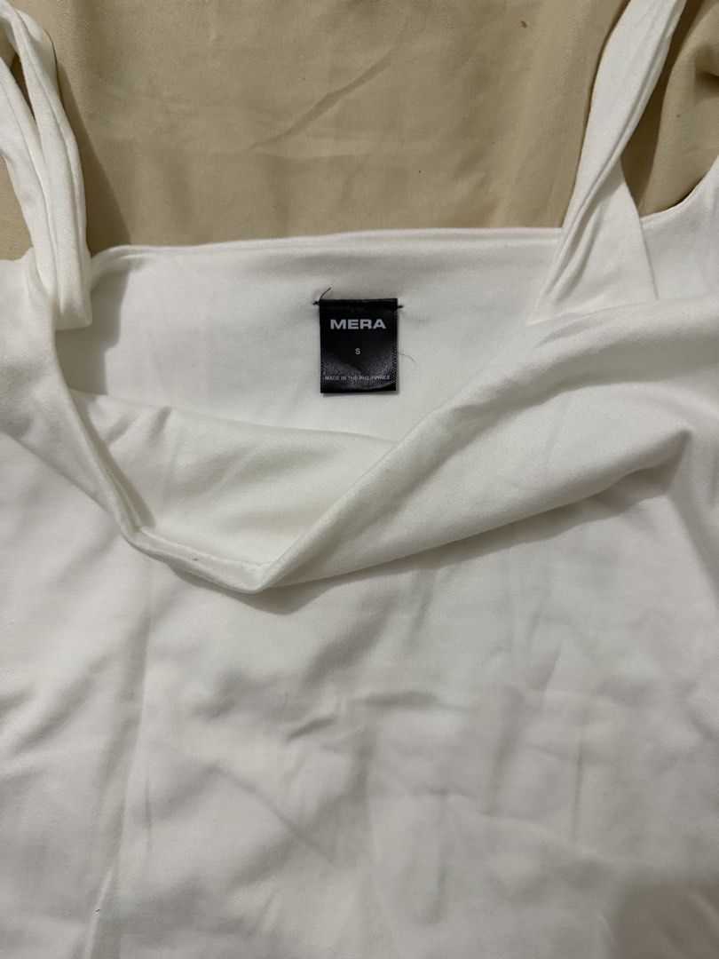 MERA White Square Neck Tank Top Size S (Category: Sleeveless) located in Cavite. Submitted by christianneeee (Listing ID 1460020001, Image 2). Description: - MERA white tank top - Square neckline with thick straps - Soft and comfortable fabric - Perfect for layering or wearing solo - A versatile essential for any wardrobe.