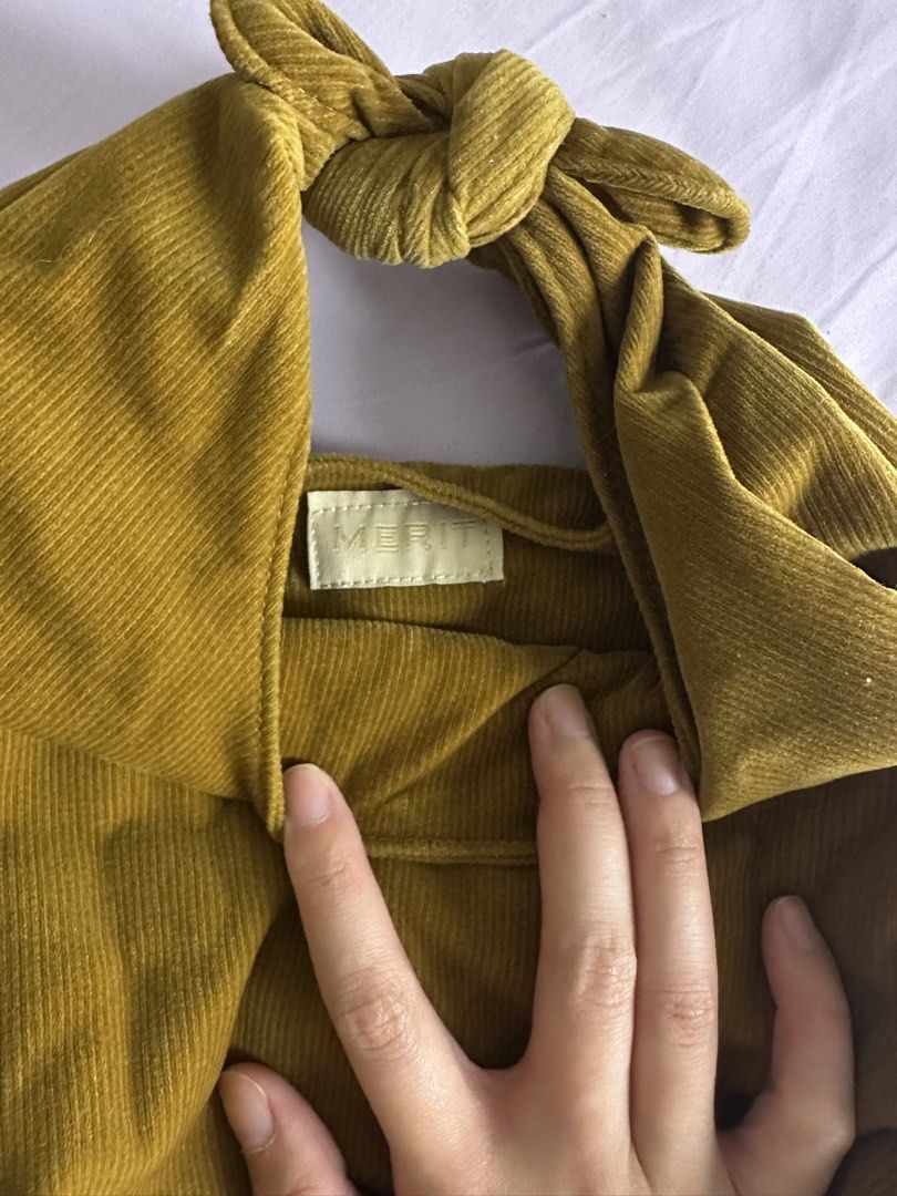 MERIT signature Corduroy Bag (Category: Purses & Pouches) located in Quezon City. Submitted by yippeegirl (Listing ID 1459996780, Image 2). Description: - Cute corduroy bag from MERIT - Knot handle design - Mustard yellow color - Soft corduroy material - Fits essentials like phone, wallet, and makeup rfs: decluttering .