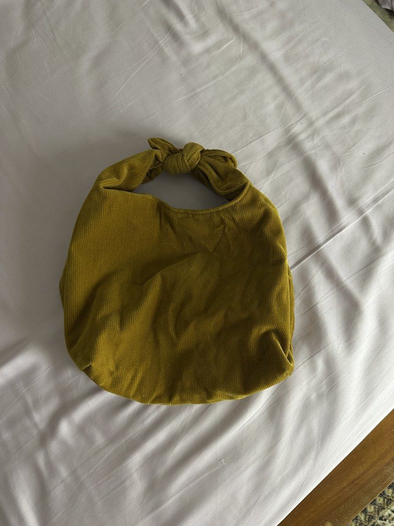 MERIT signature Corduroy Bag (Category: Purses & Pouches) located in Quezon City. Submitted by yippeegirl (Listing ID 1459996780, Image 3). Description: - Cute corduroy bag from MERIT - Knot handle design - Mustard yellow color - Soft corduroy material - Fits essentials like phone, wallet, and makeup rfs: decluttering .