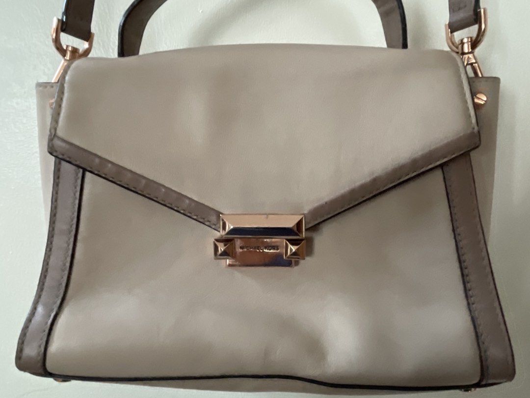 Michael Kors Beige Leather Satchel Handbag (Category: Luxury Bags & Wallets) located in San Juan City. Submitted by redrosierose (Listing ID 1459979302, Image 2). Description: - preloved Beige Michael Kors leather satchel - Top handle and detachable crossbody strap -Please see all photos for flaws -bawal sa maarte - Rose gold hardware details - Minor scuffs on closure - Some marks on the back - Ideal for everyday use RFS: Decluttering LOC: San Ju