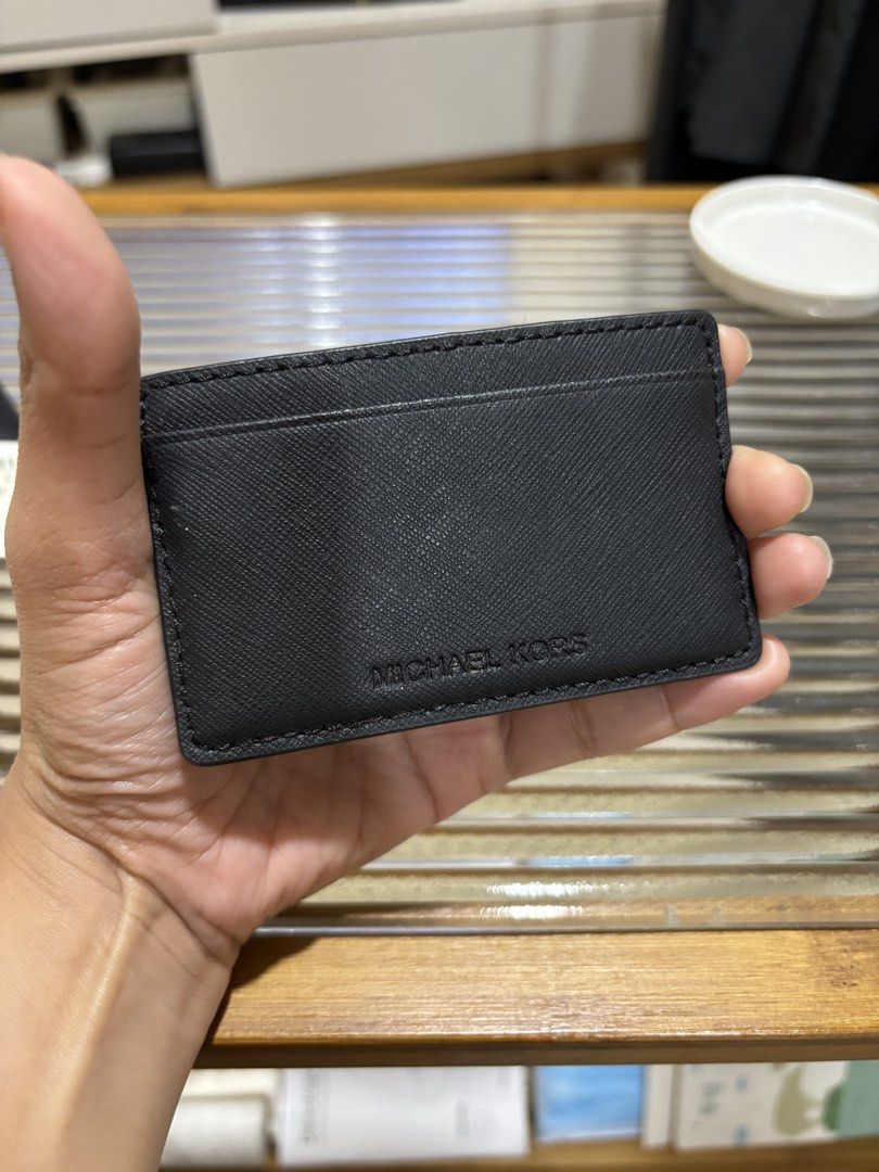 Michael Kors Black Leather Card Holder (Category: Wallets & Card holders) located in Las Pinas. Submitted by drecessionista (Listing ID 1459985187, Image 2). Description: - Genuine Michael Kors black leather card holder - Features multiple card slots for easy organization - Sleek and minimalist design - Compact size fits perfectly in pockets or small bags.