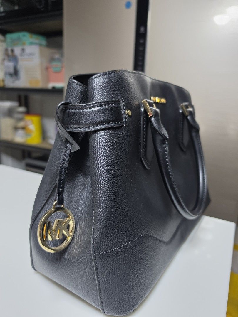 Michael Kors Black Leather Satchel Handbag (Category: Luxury Bags & Wallets) located in Manila. Submitted by mysticdog_e45c29 (Listing ID 1460004008, Image 3). Description: - Used once (RFS: resigned from corporate) - Gold hardware details - Comfortable top handles - Includes a detachable shoulder strap - Spacious main compartment with secure zip closure - Ideal for office/corporate use.