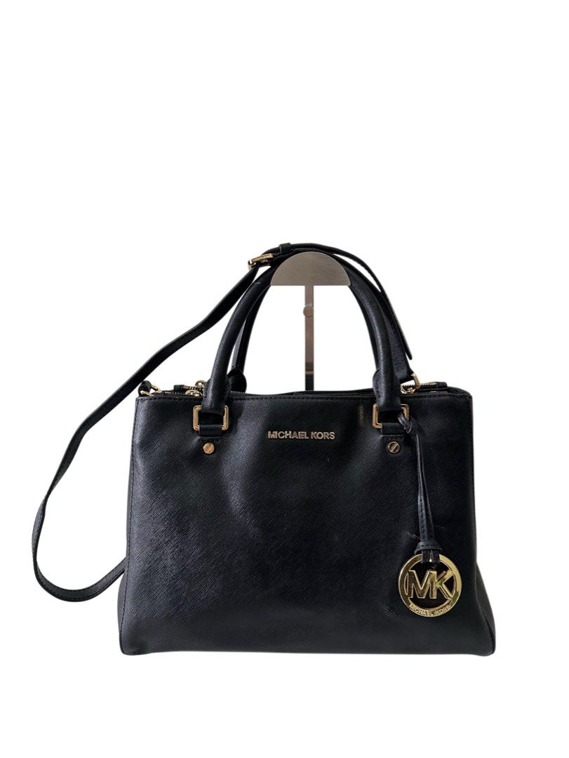 Michael Kors Black Leather Satchel Handbag (Category: Luxury Bags & Wallets) located in Manila. Submitted by gentle.bagmomma (Listing ID 1460081230, Image 1). Description: -Guaranteed Authentic -Excellent condition with few normal signs of usage - Top handles and detachable crossbody strap - Iconic MK logo charm - Spacious interior for essentials .