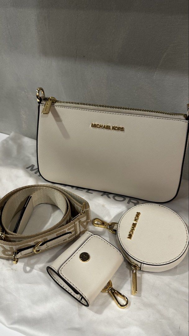 Michael Kors Cream Leather 3-Piece Set with Strap (Category: Luxury Bags & Wallets) located in Rizal. Submitted by dumbchowdy (Listing ID 1460035734, Image 2). Description: - Authentic Michael Kors cream leather jet set - Includes crossbody bag, coin pouch, and card holder - Features elegant gold hardware details - Comes with a stylish patterned adjustable strap - dust bag but needs to be cleaned - Interior lined with Michael Kors logo - Ideal fo