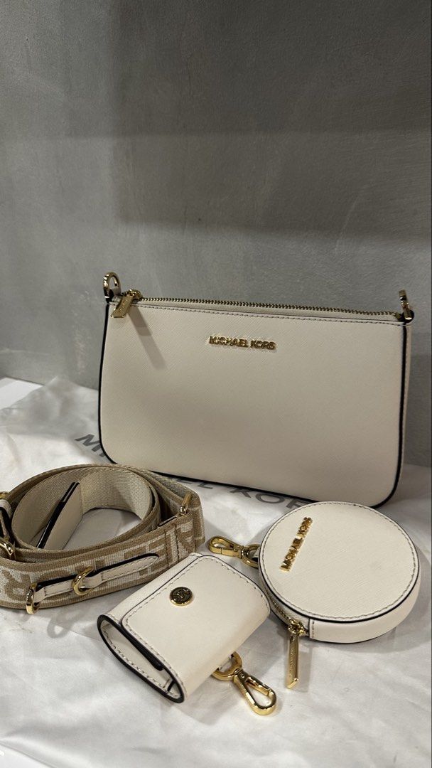 Michael Kors Cream Leather 3-Piece Set with Strap (Category: Luxury Bags & Wallets) located in Rizal. Submitted by dumbchowdy (Listing ID 1460035734, Image 1). Description: - Authentic Michael Kors cream leather jet set - Includes crossbody bag, coin pouch, and card holder - Features elegant gold hardware details - Comes with a stylish patterned adjustable strap - dust bag but needs to be cleaned - Interior lined with Michael Kors logo - Ideal fo