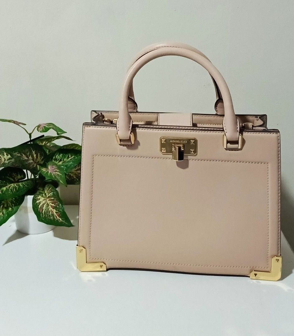 Michael Kors Pink Leather Top Handle Bag (Category: Luxury Bags & Wallets) located in Dasmarinas. Submitted by lgecarg2026 (Listing ID 1460025496, Image 1). Description: - Authentic Michael Kors handbag - Soft pink genuine leather - Elegant top handle design - Chic gold hardware accents - Secure top zipper closure - Spacious interior with multiple compartments - Perfect for daily use or special events.