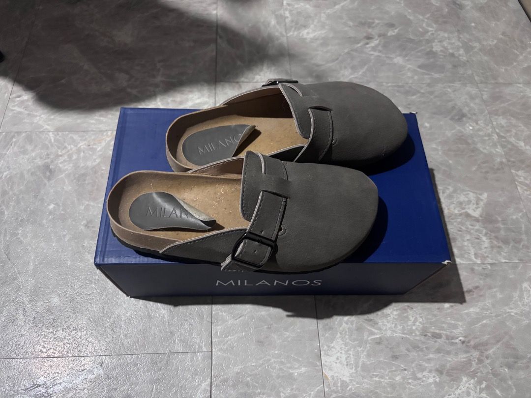 Milanos Tyson Clogs (Category: Casual Shoes) located in Binan City. Submitted by sonnycole (Listing ID 1460097560, Image 3). Description: Milanos Tyson Clogs Grey With Original Box US6 EU40 Synthetic leather with cork outsole Mule type with velcro upper Comfortable and lightweight See issue at the last slide, other than that, wala ng issue. Bought last Feb 2026 Original Price: 699.00 (Bought from SM Dept Store) Selling Price: 349.00.