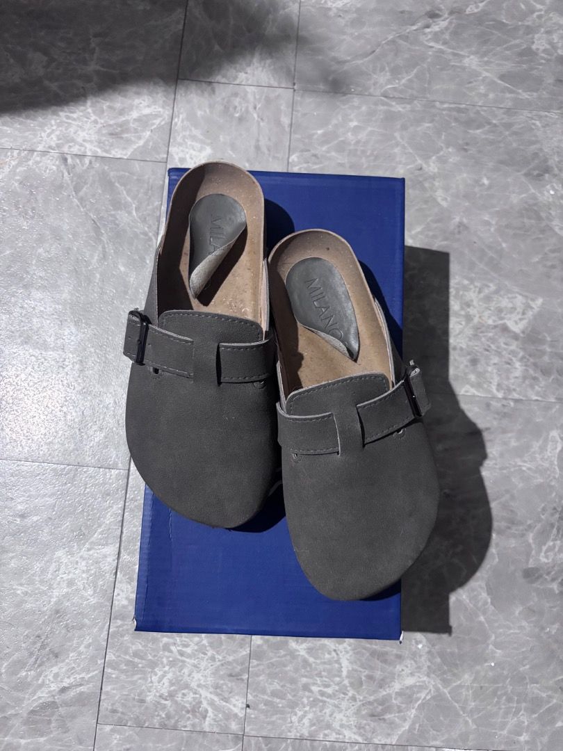 Milanos Tyson Clogs (Category: Casual Shoes) located in Binan City. Submitted by sonnycole (Listing ID 1460097560, Image 2). Description: Milanos Tyson Clogs Grey With Original Box US6 EU40 Synthetic leather with cork outsole Mule type with velcro upper Comfortable and lightweight See issue at the last slide, other than that, wala ng issue. Bought last Feb 2026 Original Price: 699.00 (Bought from SM Dept Store) Selling Price: 349.00.
