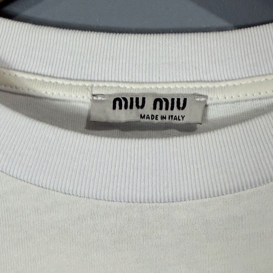 MIU MIU (Category: Blouses) located in Mangaldan. Submitted by restyletrends.ph (Listing ID 1460076860, Image 3). Description: MIU MIU Size : Medium to Large Length : 19 Width : 20 Color rate : 10/10 Like new No issue.