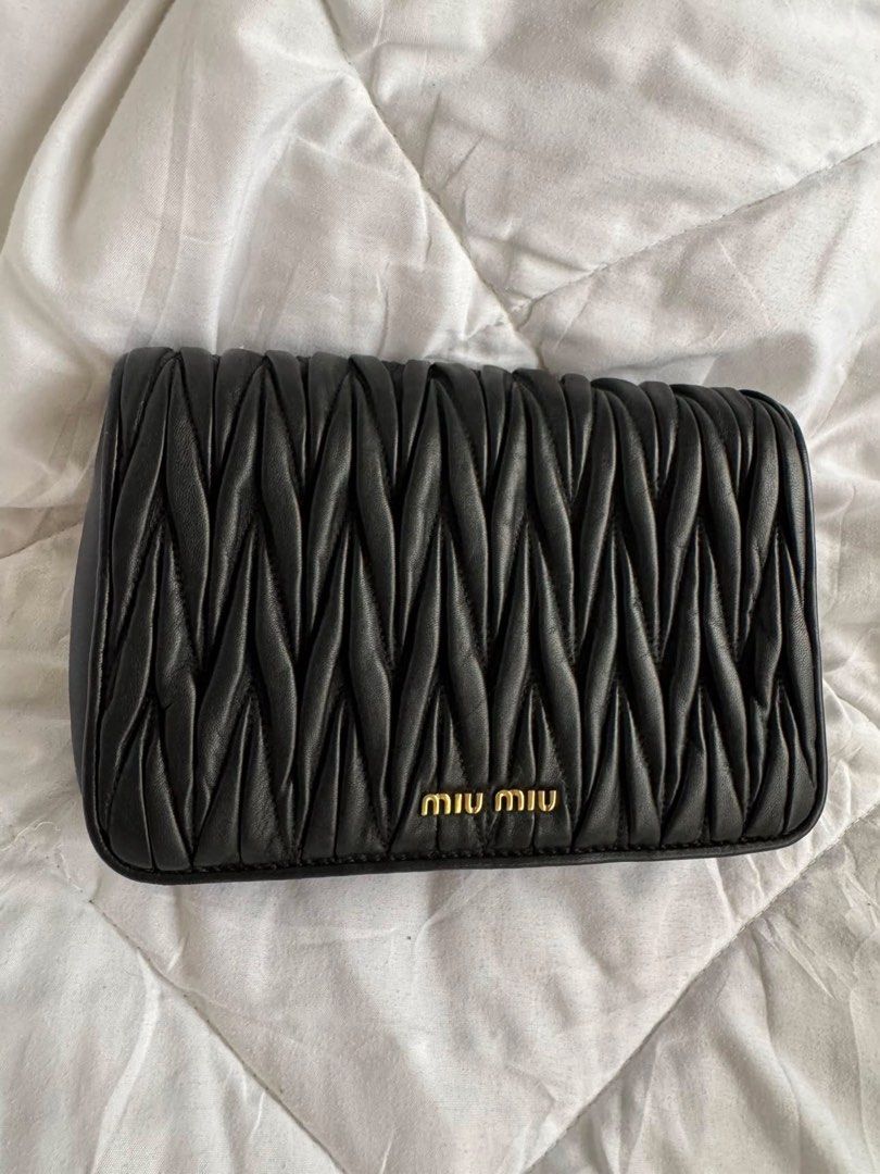 Authentic Miu Miu Black Matelassé with COA (Category: Luxury Bags & Wallets) located in Angeles City. Submitted by thala.1204.68 (Listing ID 1460052042, Image 1). Description: - Authentic Miu Miu Matelasse with B101 Revue certificate for authenticity/100% original - Signature matelassé leather - Detachable strap included - Elegant gold hardware .