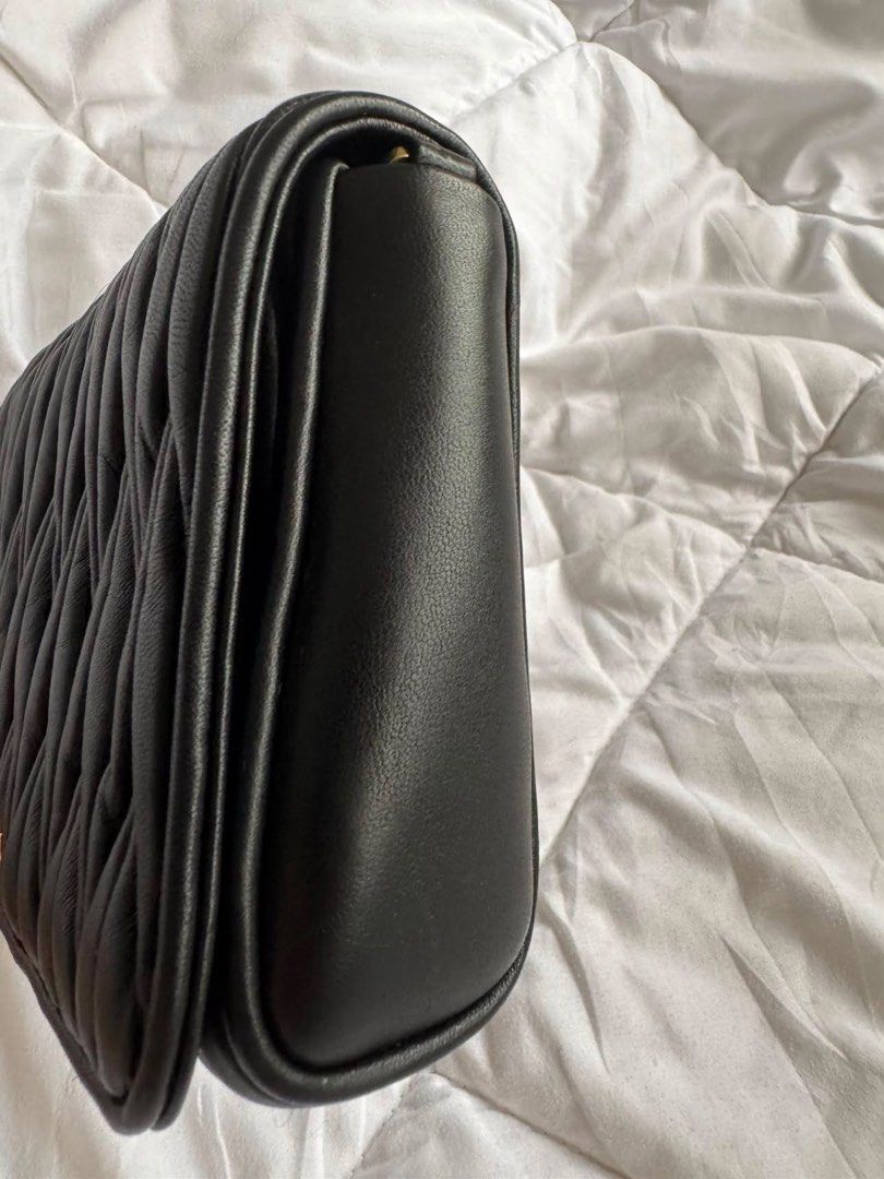 Authentic Miu Miu Black Matelassé with COA (Category: Luxury Bags & Wallets) located in Angeles City. Submitted by thala.1204.68 (Listing ID 1460052042, Image 2). Description: - Authentic Miu Miu Matelasse with B101 Revue certificate for authenticity/100% original - Signature matelassé leather - Detachable strap included - Elegant gold hardware .