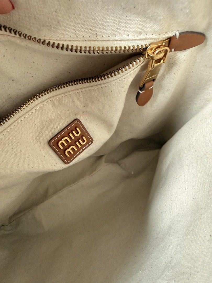 Miu Miu Ivy Leather Bag (Category: Shoulder Bags) located in Makati City. Submitted by anbnchn (Listing ID 1459984754, Image 3). Description: - bought 2nd hand in Fukuoka - can’t guarantee authenticity but it’s in good condition - minor crinkling of leather (see photos) - price slightly negotiable but no lowballing pls or else you’ll be blocked - with dustbag.