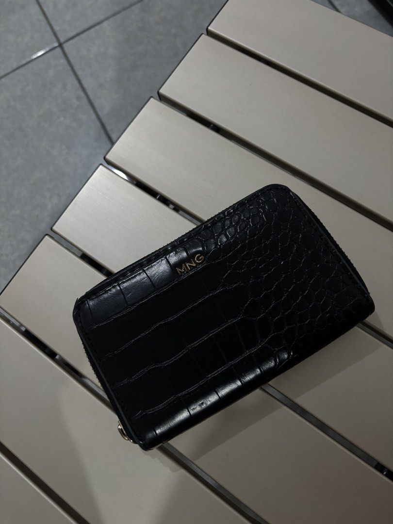 MNG Black Croc Zip Around Wallet (Category: Wallets & Card holders) located in Manila. Submitted by lai.p (Listing ID 1459952649, Image 2). Description: - Black MNG wallet - Croc-embossed texture - Zip-around closure - Gold-tone MNG logo on front - Compact size, ideal for essentials - Zipper pull shows some signs of wear (please check photos for details).