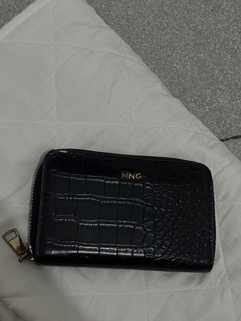 MNG Black Croc Zip Around Wallet (Category: Wallets & Card holders) located in Manila. Submitted by lai.p (Listing ID 1459952649, Image 1). Description: - Black MNG wallet - Croc-embossed texture - Zip-around closure - Gold-tone MNG logo on front - Compact size, ideal for essentials - Zipper pull shows some signs of wear (please check photos for details).