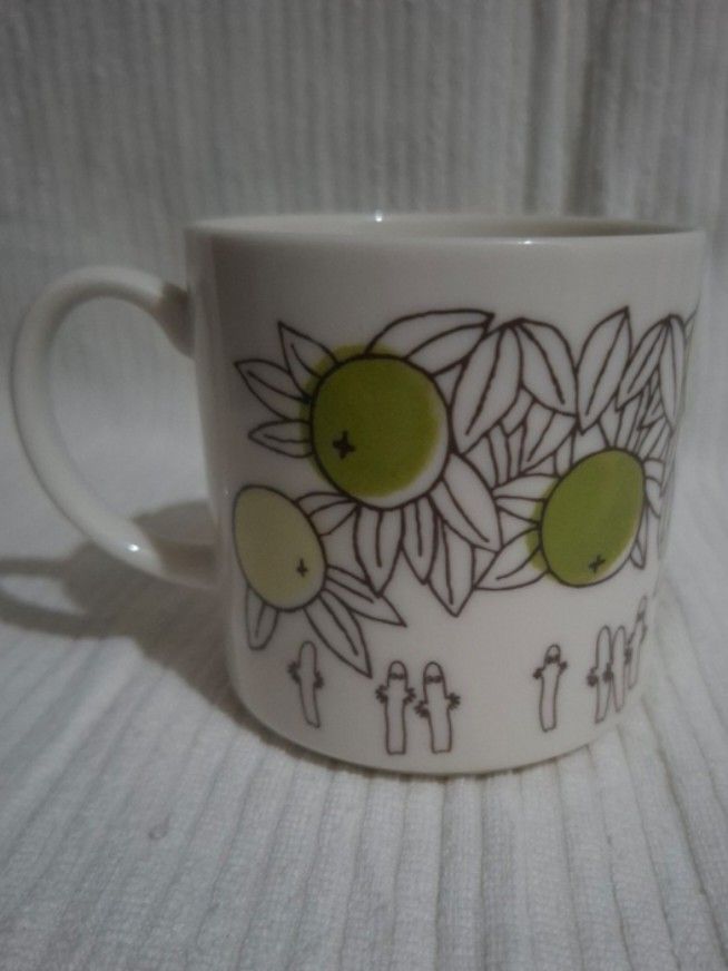 Moomin Characters Snufkin Mug by Yamaka (Category: Coffee & Tea Tableware) located in Consolacion. Submitted by luxekerei (Listing ID 1459900098, Image 2). Description: - white ceramic Moomin Characters Snufkin Ceramic Mug by Yamaka featuring green citrus fruit illustrations and Snufkin playing an accordion..
