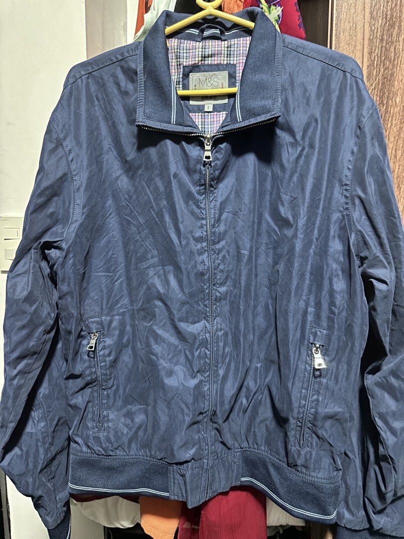 M&S Collection Navy Regular Fit Bomber Jacket (Category: Coats, Jackets and Outerwear) located in Cavite. Submitted by yong_mountaineering (Listing ID 1460044213, Image 1). Description: - Navy blue bomber jacket from M&S Collection - Regular fit - Zip-up front with two zip pockets - Lined with classic plaid pattern - Ribbed collar, cuffs, and hem - Ideal for casual wear.