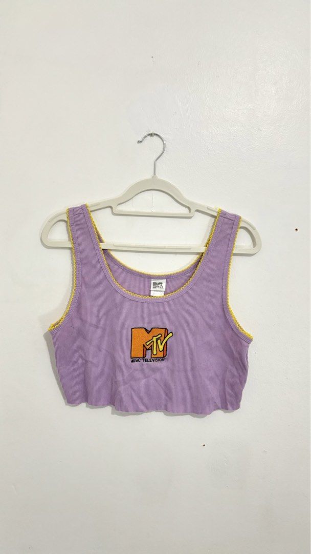MTV Graphic Ribbed Crop Tank Top (Category: Sleeveless) located in Caloocan City. Submitted by buymethisandthat (Listing ID 1460029128, Image 1). Description: ✨ MTV Graphic Ribbed Crop Tank Top with Yellow Trim - ₱149 📌 CONDITION • Condition: 9/10 • Flaws: None visible 📏 SIZE • Tag Size: XL • Recommended: Fits Medium to Large as a crop top .
