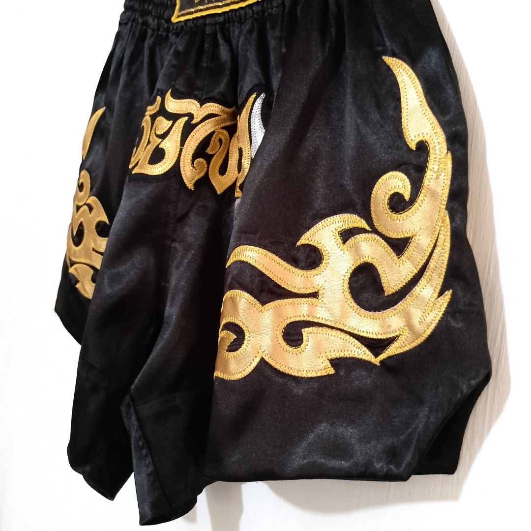 Muay Thai Shorts (Category: Activewear) located in Tuguegarao City. Submitted by thriftedtreasures101.1 (Listing ID 1459988694, Image 3). Description: Traditional Muay Thai shorts with classic Thai embroidery designed from slick satin to maximize comfort, mobility and breathability for high kicks and intense training. Slightly used, in good condition. Size Medium. Measurement on tape laid flat: Waist - 13" (unstretched) Length - 15" ‎ ‎📍 Locatio