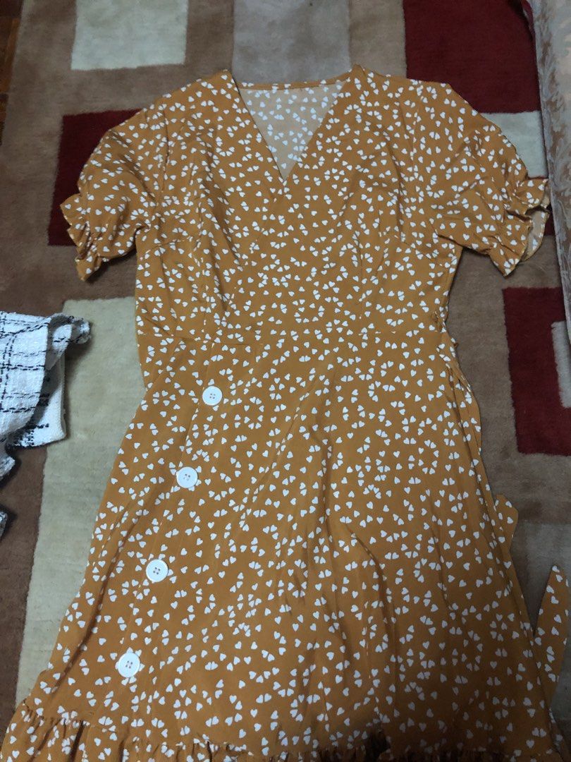 Mustard Yellow Heart Print Button Down Dress (Category: Dresses) located in Bulacan. Submitted by shinzyx (Listing ID 1460020441, Image 1). Description: - Adorable mustard yellow dress - Charming white heart print all over - Flattering short flutter sleeves - Stylish ruffled hemline - Functional buttons down the front - Ideal for casual outings and everyday wear - Effortless to style and comfortable to wear.