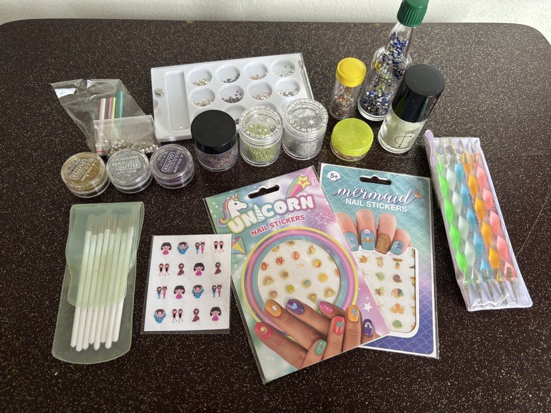 Nail Art Set (Category: Hands & Nails) located in Mandaluyong City. Submitted by caught.on.closet (Listing ID 1459981635, Image 1). Description: Nail art bundle Inclusions: - nail stickers (unicorn, mermaid, emoji) - dotting tools (5) - nail art brushes (8) - nail glitter (gold, silver, purple) - nail gems (blue, pink, red, assorted set) - nail caviar beads (green, rainbow, silver, clear) - nail appliqués (cupcake, popsicle, watermelon) TAKE ALL 