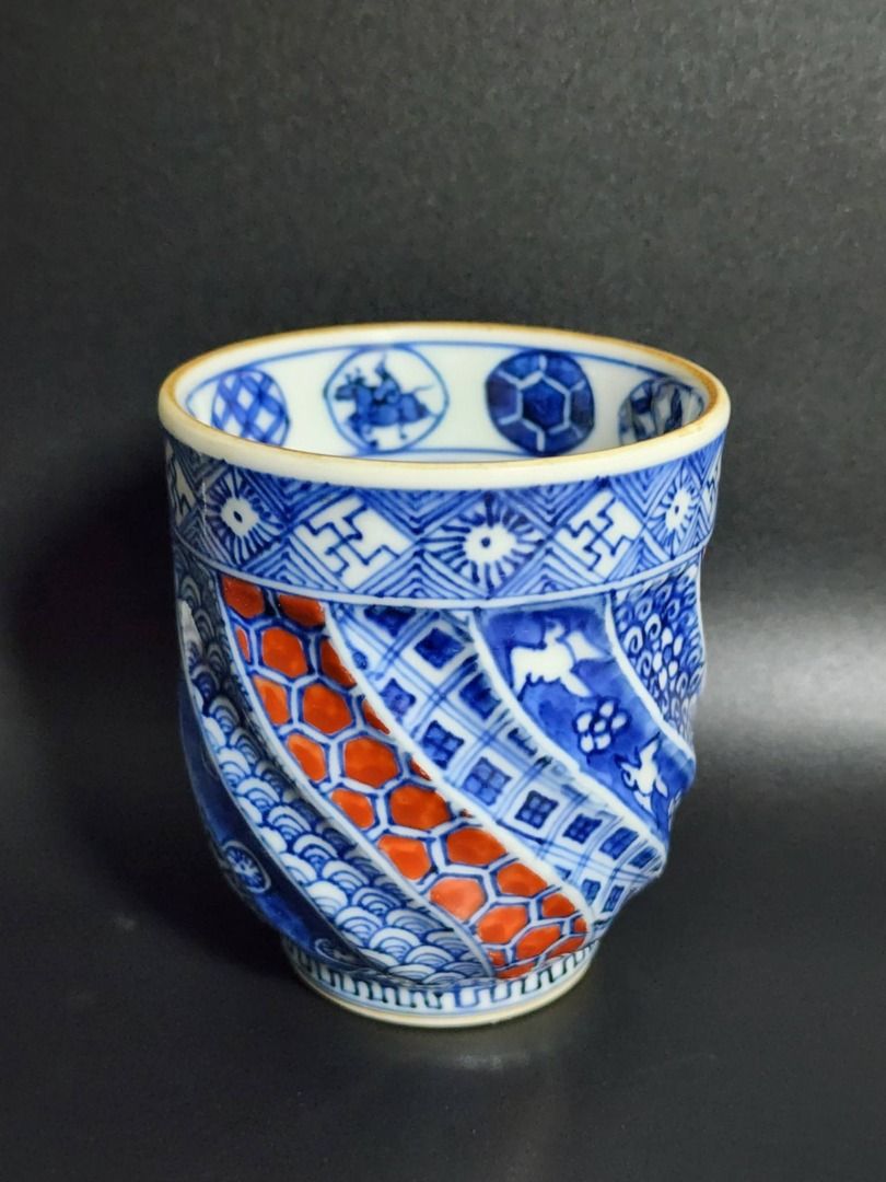 Neji Shonzui Yunomi Teacup (Category: Coffee & Tea Tableware) located in Quezon City. Submitted by lacasetta (Listing ID 1460033913, Image 1). Description: Refined Japanese Yunomi (湯呑) featuring Neji Shonzui (捻祥瑞), a traditional blue-and-white pattern characterized by its distinctive twisted, spiral composition. Presented in the elegant tradition of Kyoto pottery, with finely executed indigo decoration. Style: Neji Shonzui / Kyoto pottery Type: Y