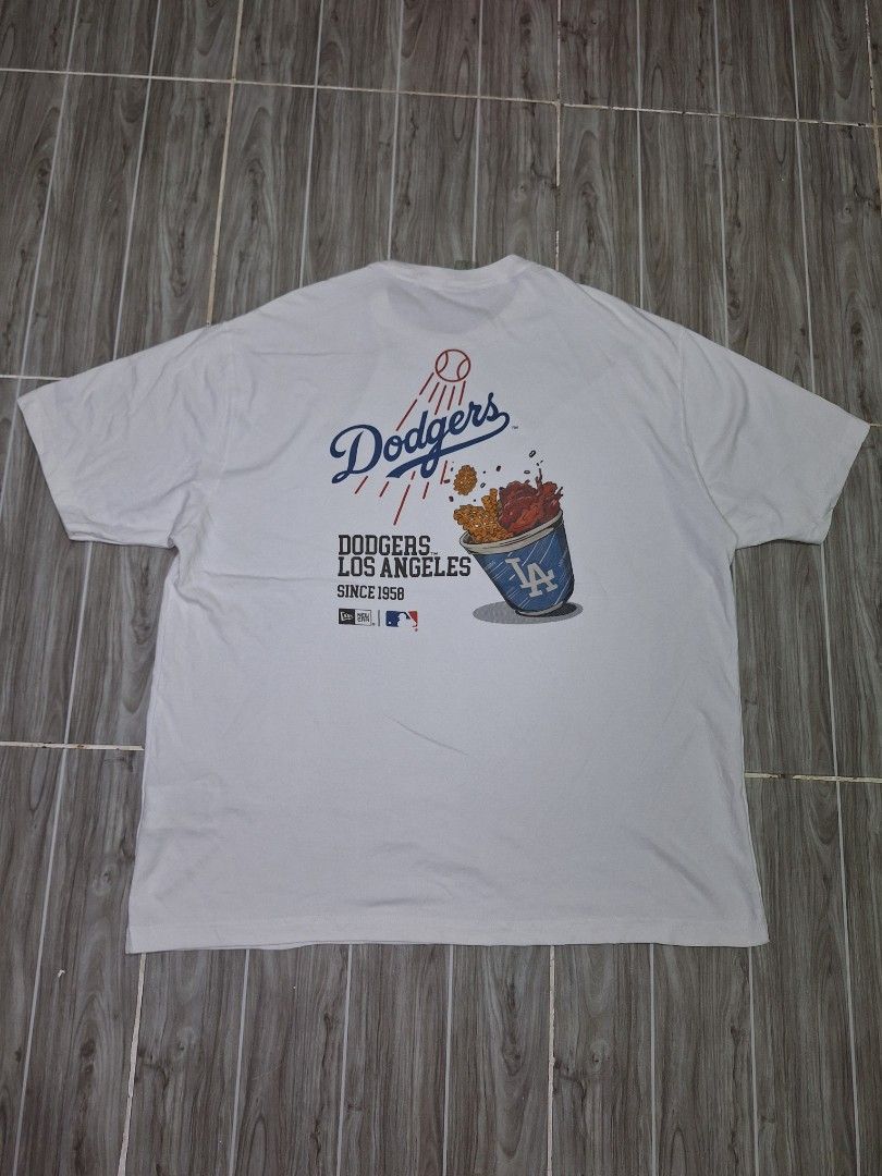 NEW ERA LA DODGERS TSHIRT (freeshipping) (Category: Tshirts & Polo Shirts ) located in Quezon City. Submitted by gyl-stop (Listing ID 1460085666, Image 2). Description: freeshipping 25.5 x 30 very good condi cr: 9.5/10 issue: washable small yellow stain di halata.