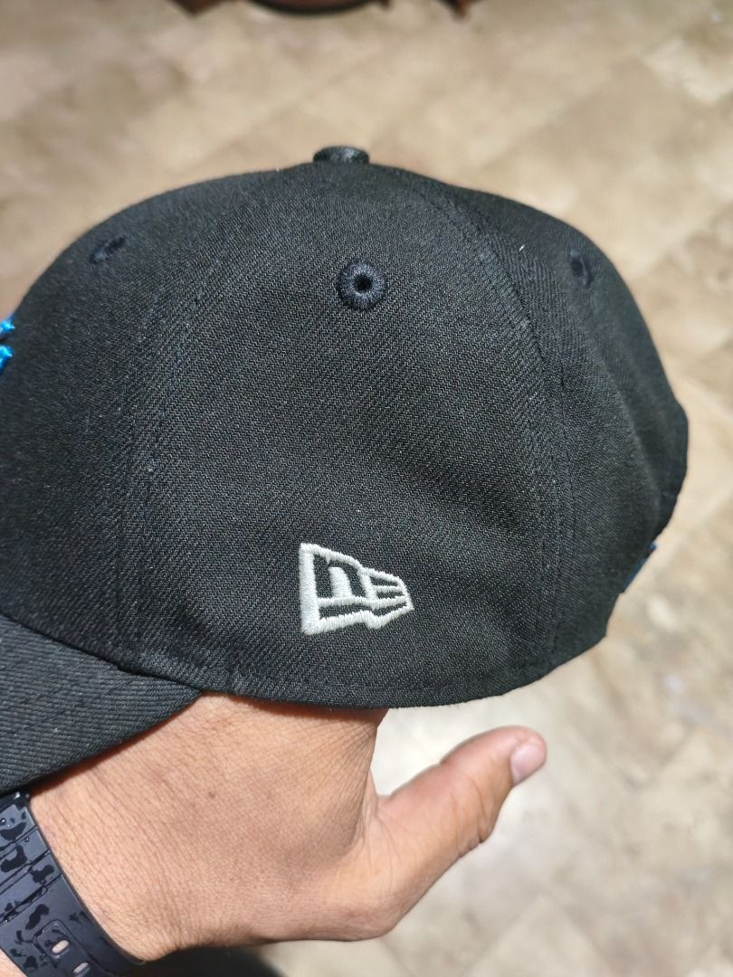 New Era Marlins 9FORTY Cap (Category: Caps & Hats) located in Santa Rosa. Submitted by izxenjairr80094 (Listing ID 1459921715, Image 2). Description: - Miami Marlins embroidered logo cap - New Era brand - Adjustable strap for a custom fit - Shows some signs of wear on the strap.