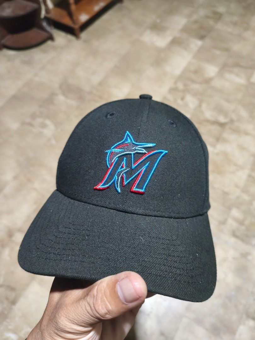 New Era Marlins 9FORTY Cap (Category: Caps & Hats) located in Santa Rosa. Submitted by izxenjairr80094 (Listing ID 1459921715, Image 1). Description: - Miami Marlins embroidered logo cap - New Era brand - Adjustable strap for a custom fit - Shows some signs of wear on the strap.