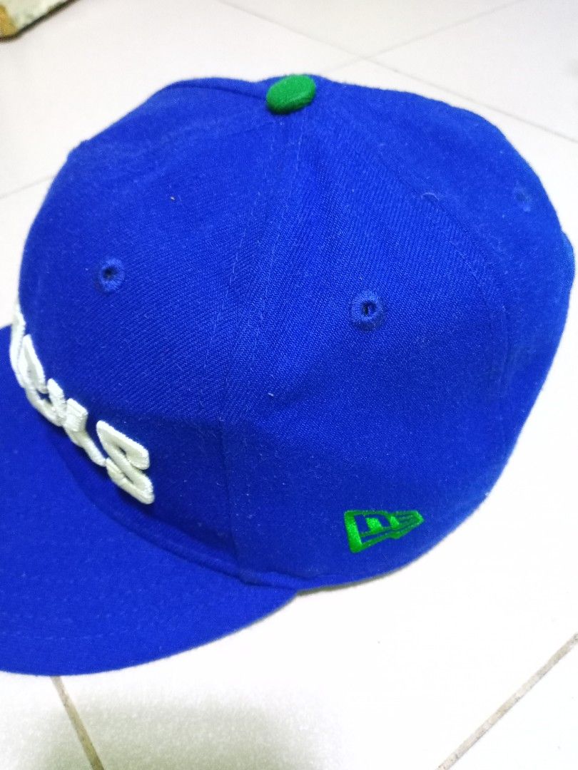 New Era Vancouver Canucks Snapback Cap (Category: Caps & Hats) located in Manila. Submitted by onewikstraight (Listing ID 1460101919, Image 2). Description: - Blue Vancouver Canucks snapback cap - White embroidered team name on front - New Era logo on the side - Adjustable green snapback closure - One size fits most - Ideal for any Canucks fan.