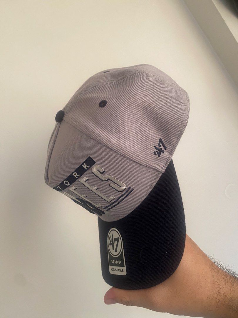 New York Yankees 47 MVP Adjustable Cap (Category: Caps & Hats) located in Manila. Submitted by madisonj (Listing ID 1460103290, Image 2). Description: - Grey and navy New York Yankees cap - Features iconic Yankees logo and 'New York Yankees' text - Adjustable back for a comfortable, custom fit - Made by reputable brand 47 Brand - A must-have for any dedicated Yankees fan!.
