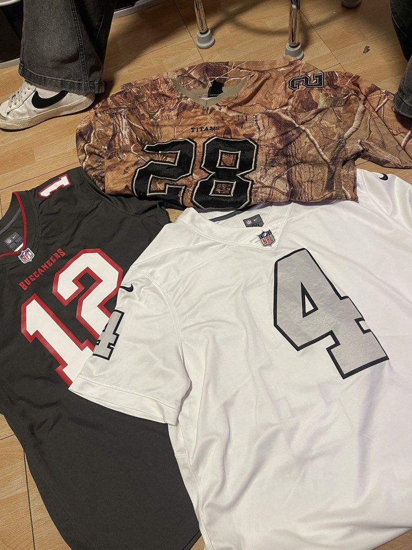 NFL Jerseys - Buccaneers, Titans, Raiders (Category: Activewear) located in Manila. Submitted by gstuffs. (Listing ID 1460038922, Image 1). Description: PM FOR DETAILS AND PRICE EACH LARGE TO XL - Set of 3 Nike NFL Jerseys - Size: Large (L) - Tampa Bay Buccaneers Jersey - Number 12 - Tennessee Titans Jersey - Number 28 (Camouflage Pattern) - Las Vegas Raiders Jersey - White, Number 4 - Ideal for any NFL football fan!.