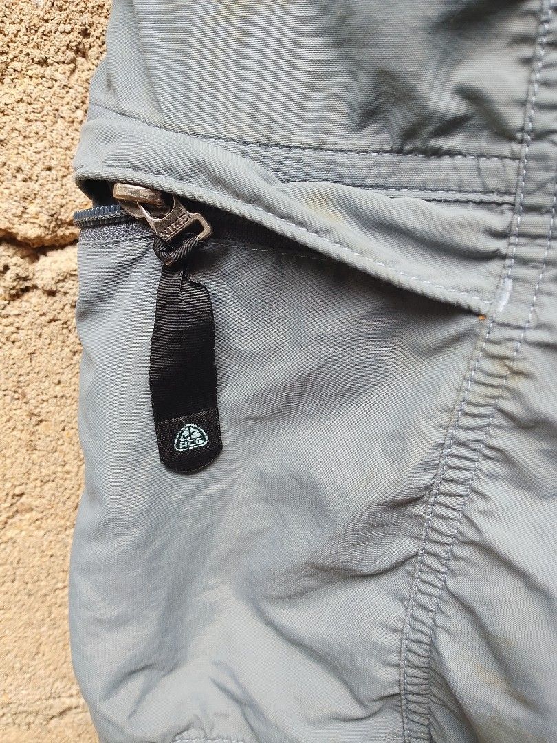 Nike ACG Cargo Shorts Size 30 (Category: Shorts) located in Manila. Submitted by uniqthrift30 (Listing ID 1459905754, Image 3). Description: - Grey Nike ACG Cargo Shorts - Waist 31-32 - Lenght 20 - Size 30 - Made in the Philippines - Multiple zip pockets with velcro closures - Ideal for outdoor adventures or everyday casual wear - Durable and long-lasting material.