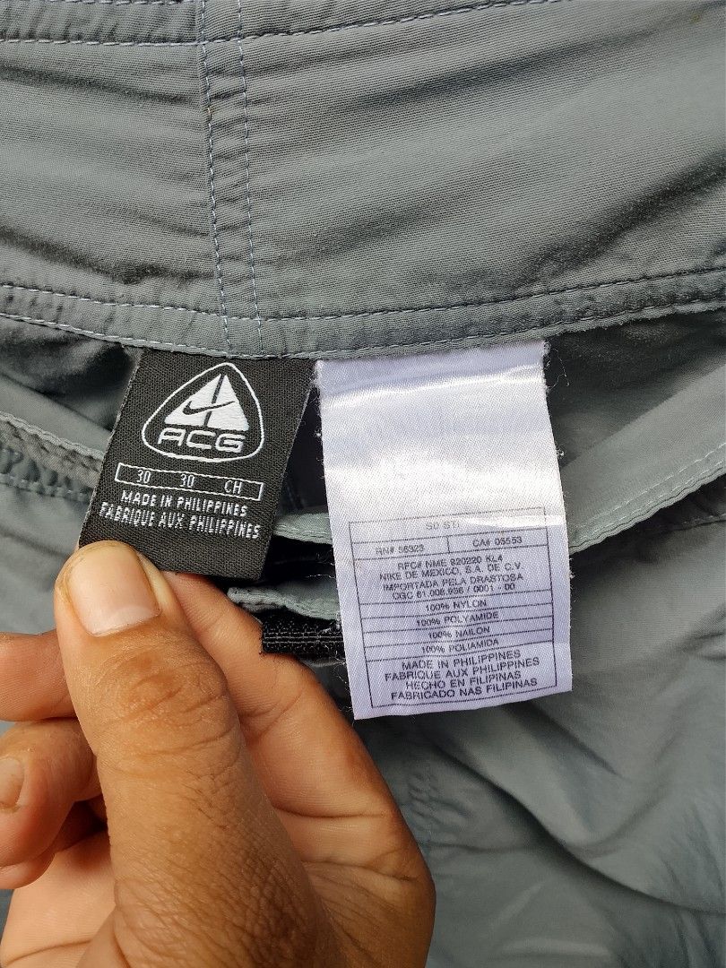 Nike ACG Cargo Shorts Size 30 (Category: Shorts) located in Manila. Submitted by uniqthrift30 (Listing ID 1459905754, Image 2). Description: - Grey Nike ACG Cargo Shorts - Waist 31-32 - Lenght 20 - Size 30 - Made in the Philippines - Multiple zip pockets with velcro closures - Ideal for outdoor adventures or everyday casual wear - Durable and long-lasting material.