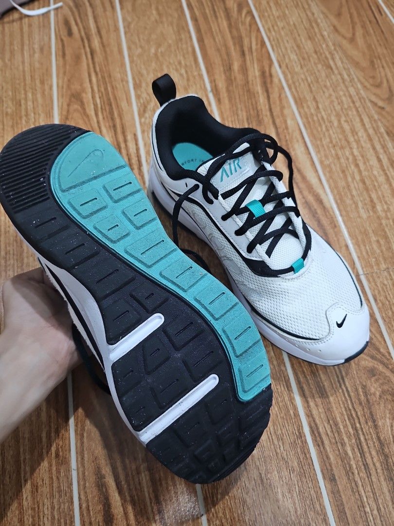 Nike Air Max Shoes (Category: Sneakers) located in Quezon City. Submitted by edzsxc (Listing ID 1460025123, Image 3). Description: - White Nike Air Max sneakers - Black and teal accent details - Lace-up closure - Comfortable for running or everyday wear - Selling because they no longer fit.