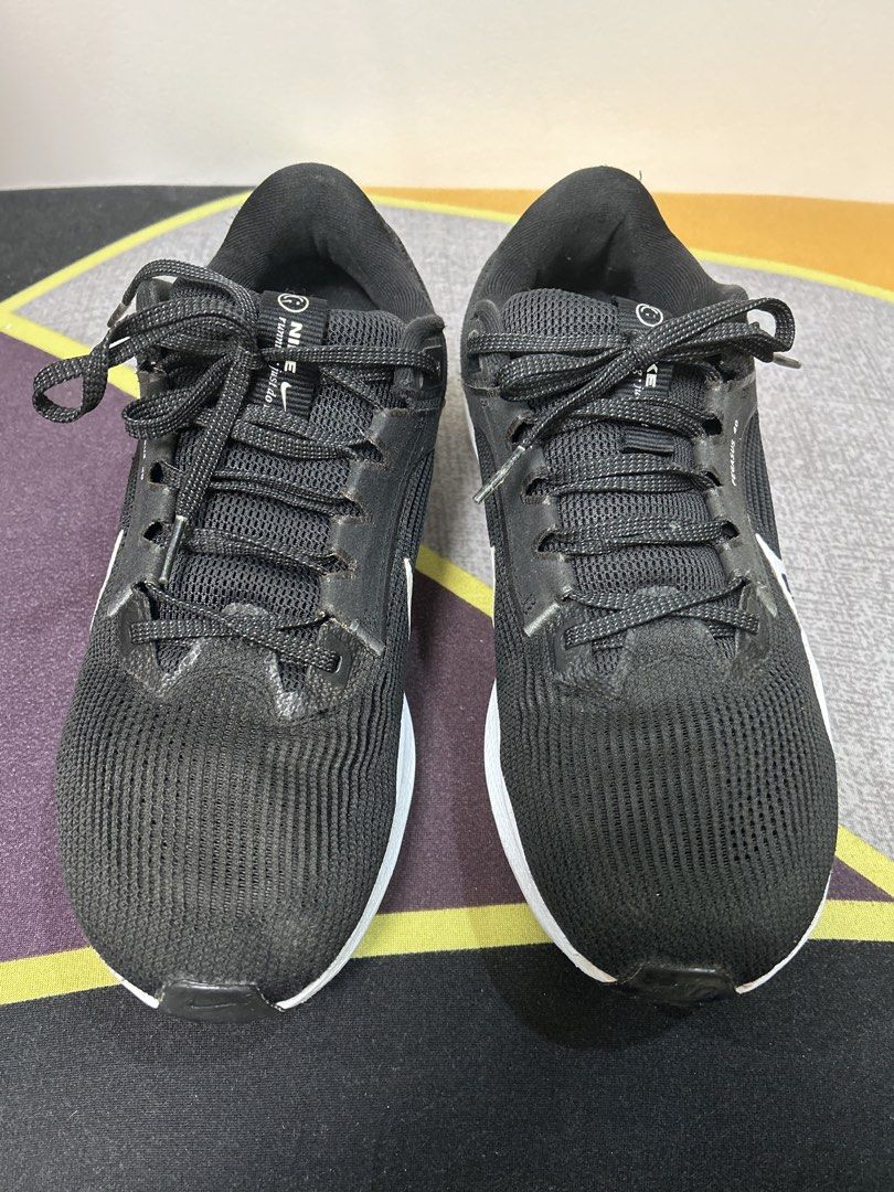 Nike Air Zoom Pegasus 40 (Category: Sneakers) located in Marikina City. Submitted by ek-goods (Listing ID 1460029674, Image 2). Description: - Nike Air Zoom Pegasus 40 - Color: Black with White Swoosh - Size: US 9 / EUR 42.5 - Ideal for running and everyday wear - Shows minor signs of use on soles - Ready for your next run!.