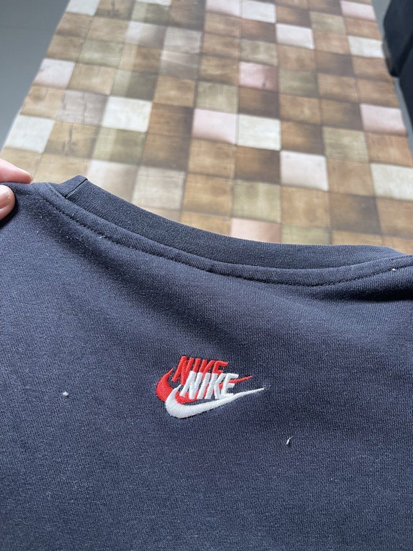 Nike Black Crewneck Sweatshirt Size L (Category: Coats, Jackets and Outerwear) located in Manila. Submitted by noahcastilljos363 (Listing ID 1459953208, Image 3). Description: - Black Nike crewneck sweatshirt - Features multiple small Nike logos (red, white, yellow) - Size: Large (L) - Material: Cotton and polyester blend - Made in Pakistan.