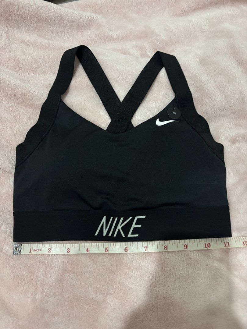 Nike Black Sports Bra Medium (Category: Activewear) located in Paranaque City. Submitted by yanyannriley (Listing ID 1460072282, Image 1). Description: - Black Nike Sports Bra - Size: Medium (M) - Criss-cross strap design at the back - Nike logo printed on the band - Ideal for workouts and athletic activities.