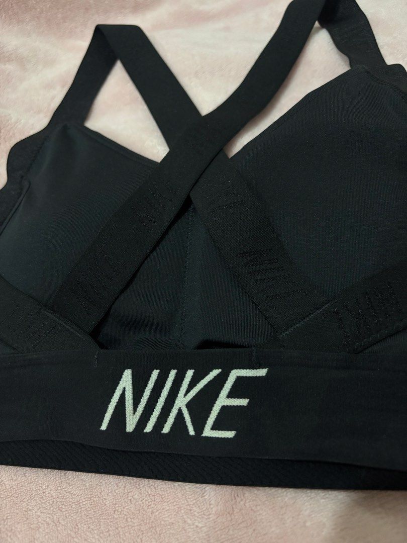 Nike Black Sports Bra Medium (Category: Activewear) located in Paranaque City. Submitted by yanyannriley (Listing ID 1460072282, Image 3). Description: - Black Nike Sports Bra - Size: Medium (M) - Criss-cross strap design at the back - Nike logo printed on the band - Ideal for workouts and athletic activities.