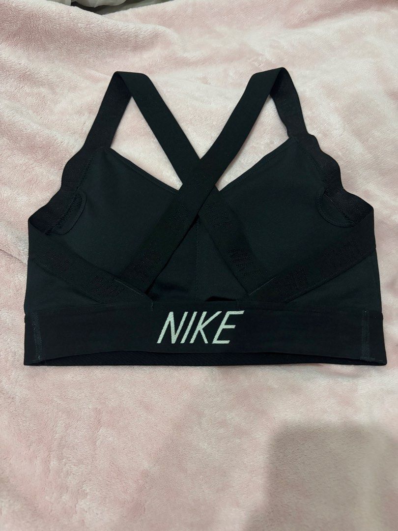 Nike Black Sports Bra Medium (Category: Activewear) located in Paranaque City. Submitted by yanyannriley (Listing ID 1460072282, Image 2). Description: - Black Nike Sports Bra - Size: Medium (M) - Criss-cross strap design at the back - Nike logo printed on the band - Ideal for workouts and athletic activities.