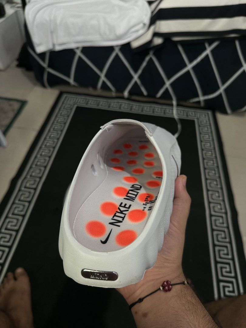 Nike Mindfield Clog White Slides (Category: Slippers & Slides) located in Manila. Submitted by kingjustvibin (Listing ID 1460099477, Image 3). Description: Comfy white Nike Mindfield clogs with orange accents. Easy slip-on style, perfect for casual wear or home. Unique textured sole. Original from canada no box cause bo space for airport bag. Rare color and softness worn 1time just fitting .