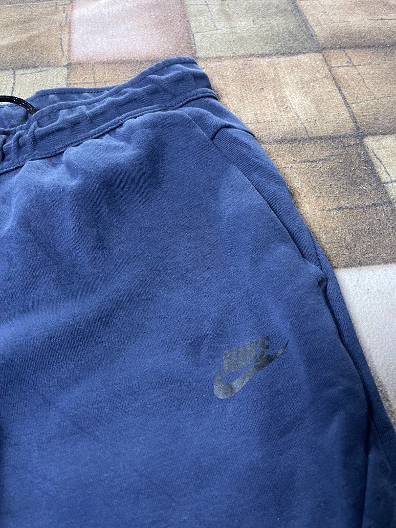 Nike Navy Blue Tech Fleece Joggers Size L (Category: Joggers) located in Manila. Submitted by noahcastilljos363 (Listing ID 1459953211, Image 2). Description: - Nike Tech Fleece Joggers - Color: Navy Blue - Size: Large (L) - Made in Cambodia - Features elastic waistband with drawstring - Ribbed cuffs for a snug fit - Ideal for casual wear or workouts.