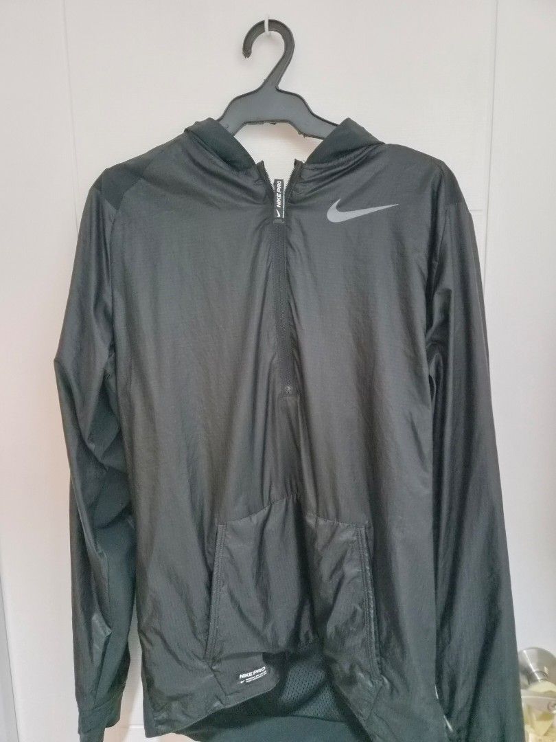Nike Pro Black Lightweight Running Jacket (Category: Coats, Jackets and Outerwear) located in Taguig. Submitted by jyb1893 (Listing ID 1459915693, Image 1). Description: - Black Nike Pro jacket - Lightweight material, ideal for running or training - Zip-up front with convenient pockets - Signature Nike Swoosh logo on the chest - Mesh paneling on the back for enhanced breathability Size Small but fits Medium.